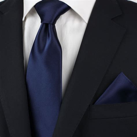 black suit dark blue tie.